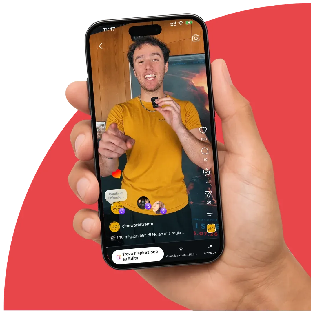 Una mano regge uno smartphone che mostra un reel Instagram del profilo di Cineworld Trento.